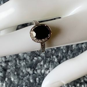 Ring Black stone with clear stones surrounding set in silver tone Size 6 1/2